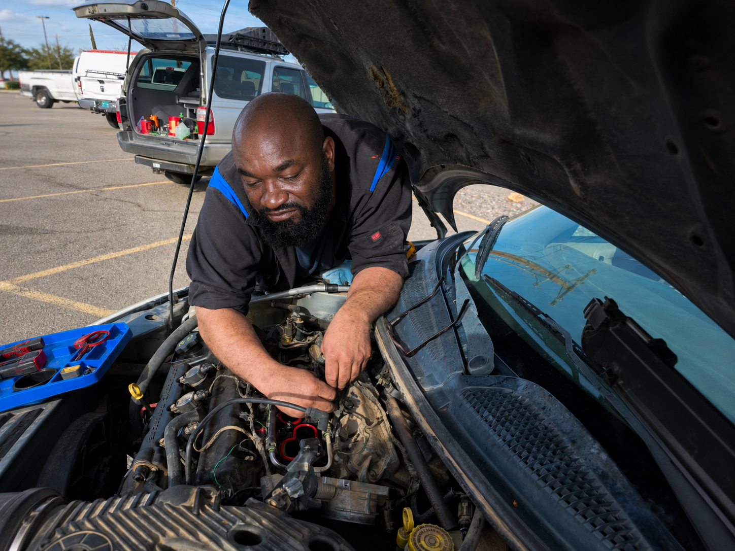 Mobile mechanic performing engine diagnostics in Arlington Texas